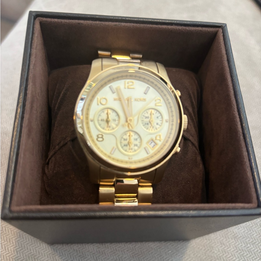 Michael Kors gold watch.